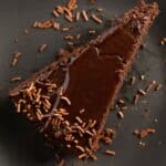 overhead view of a slice of bailey's chocolate cake with glaze and streusel.