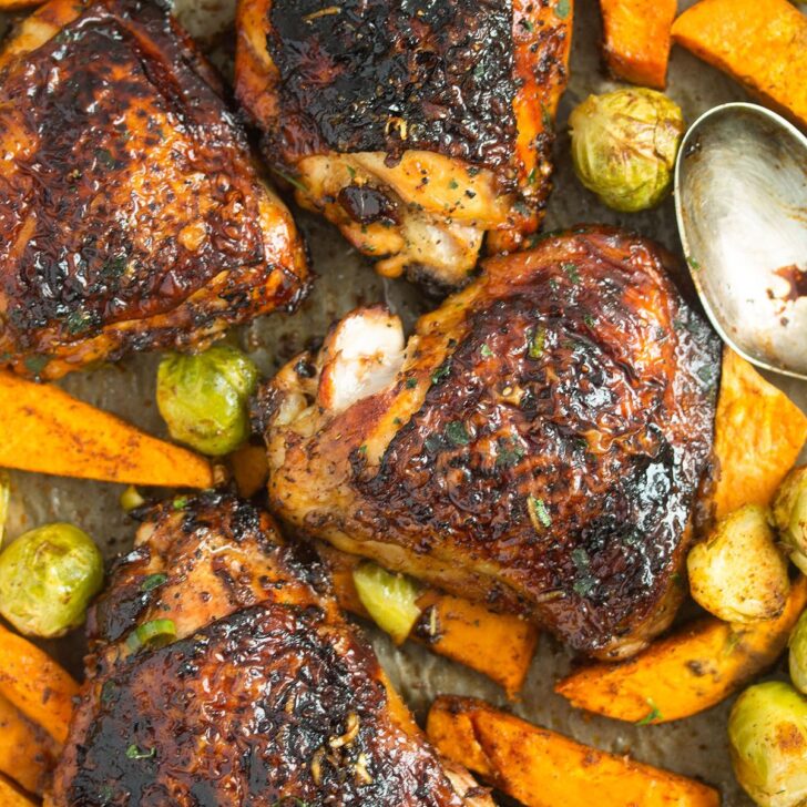 four baked chicken and sweet potatoes close up.