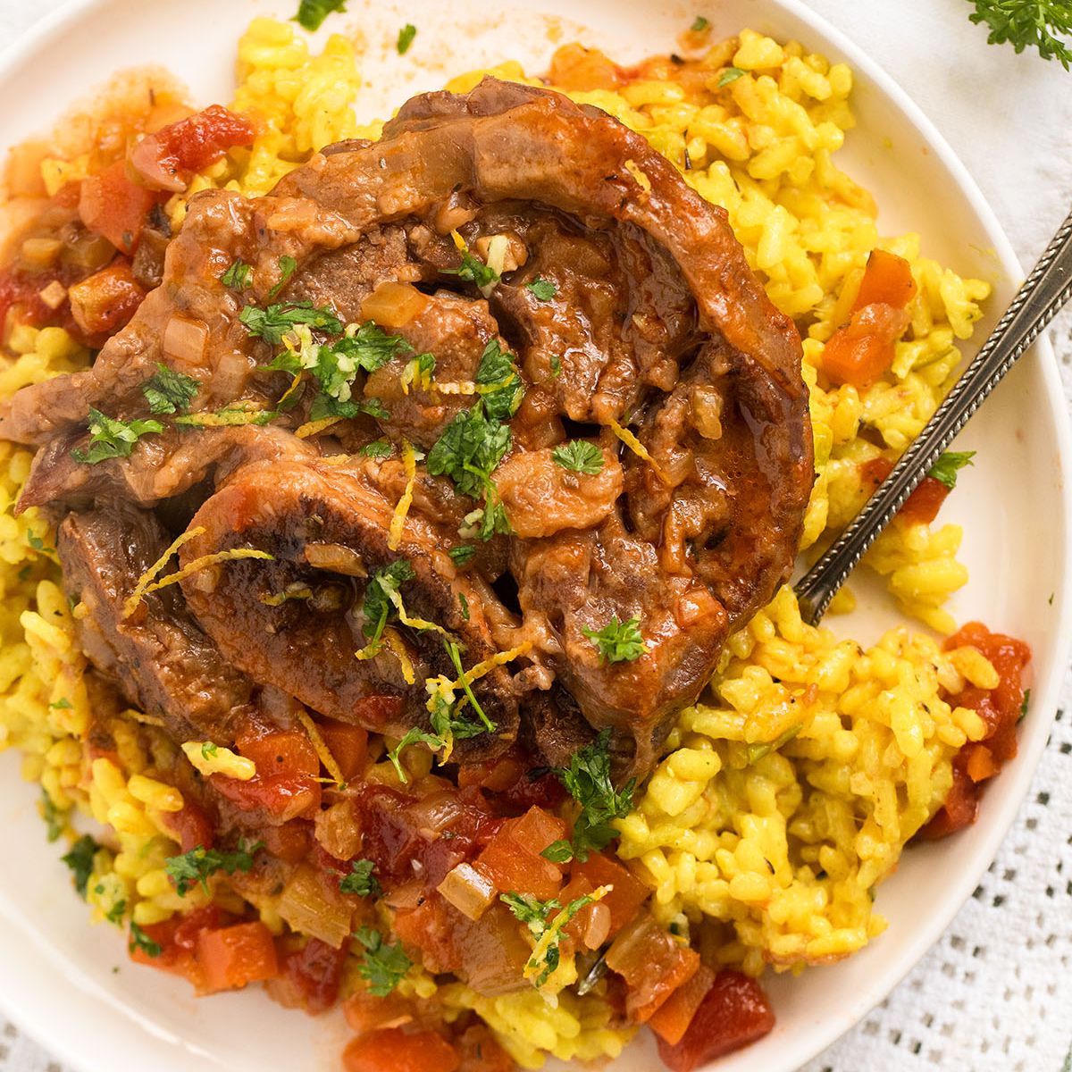 instant pot osso buco on a bed of risotto milanese.