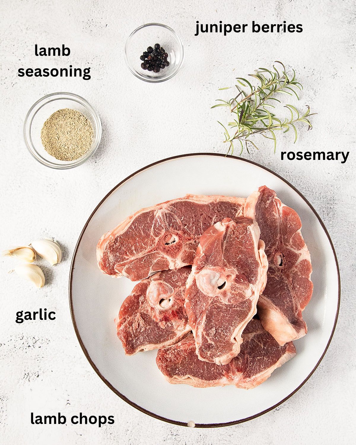 labeled ingredients for cooking lamb chops with rosemary and garlic.