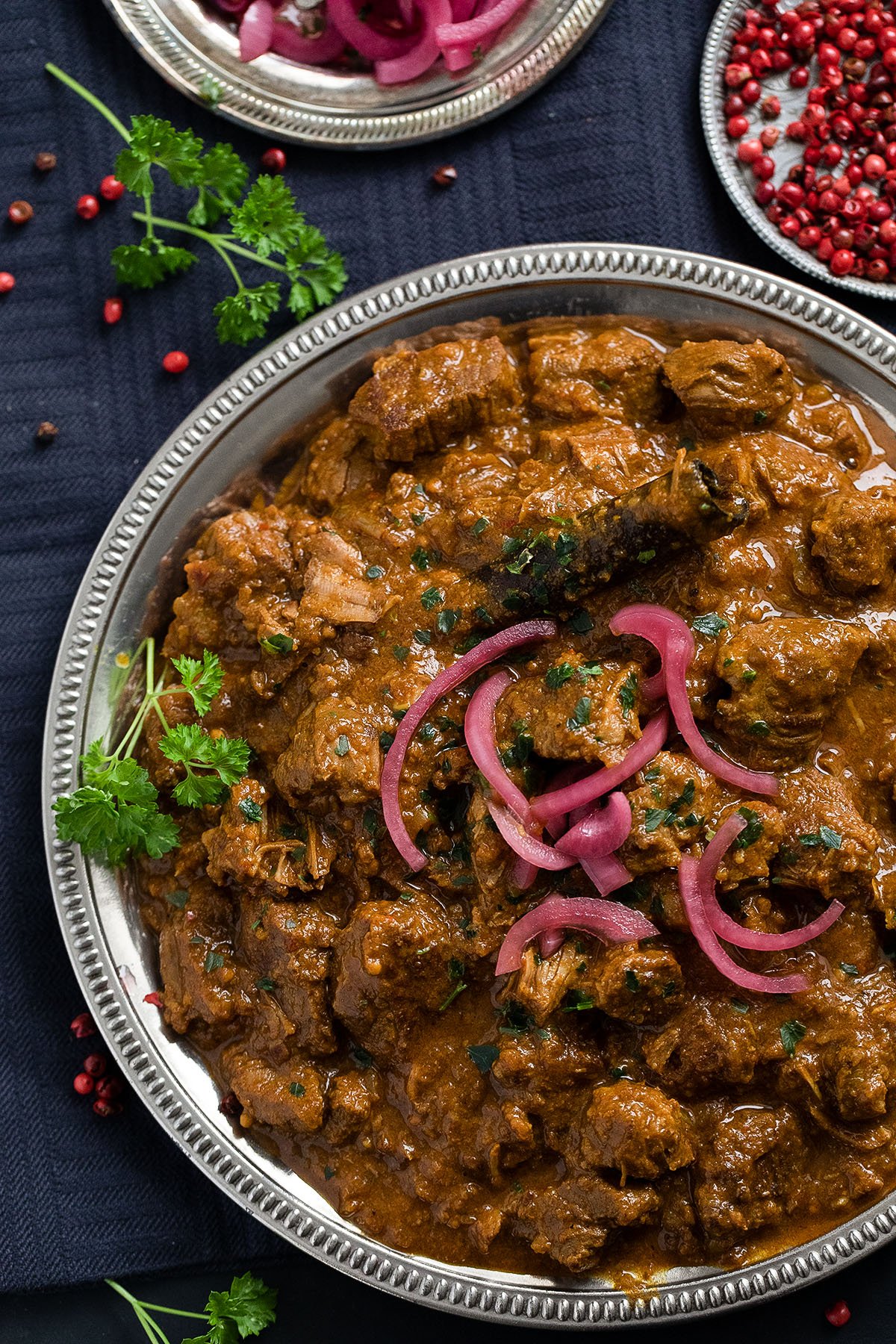 plate with indian curry with lamb slow cooked.