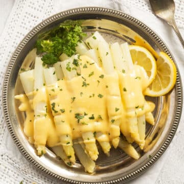 overhead view of a white asparagus cooked german-style.