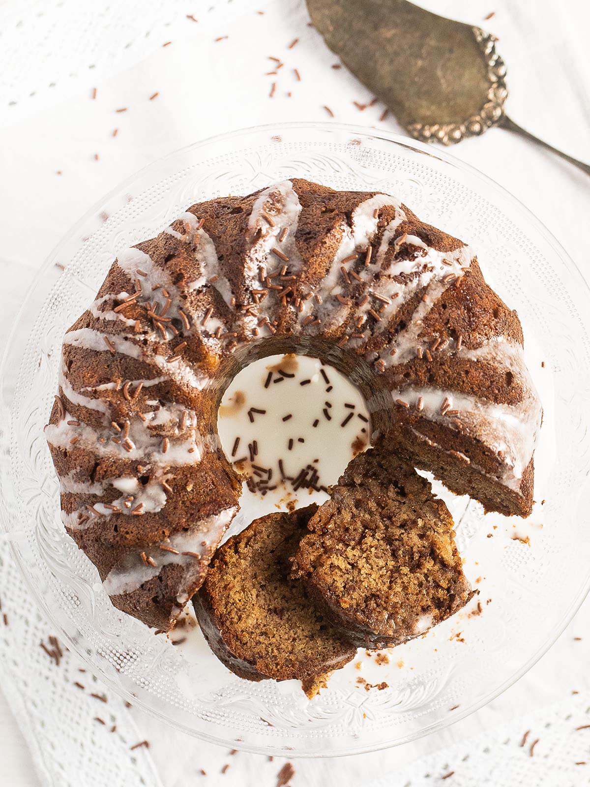 overhead view of a bundt cake with bananas and chocolate chips.