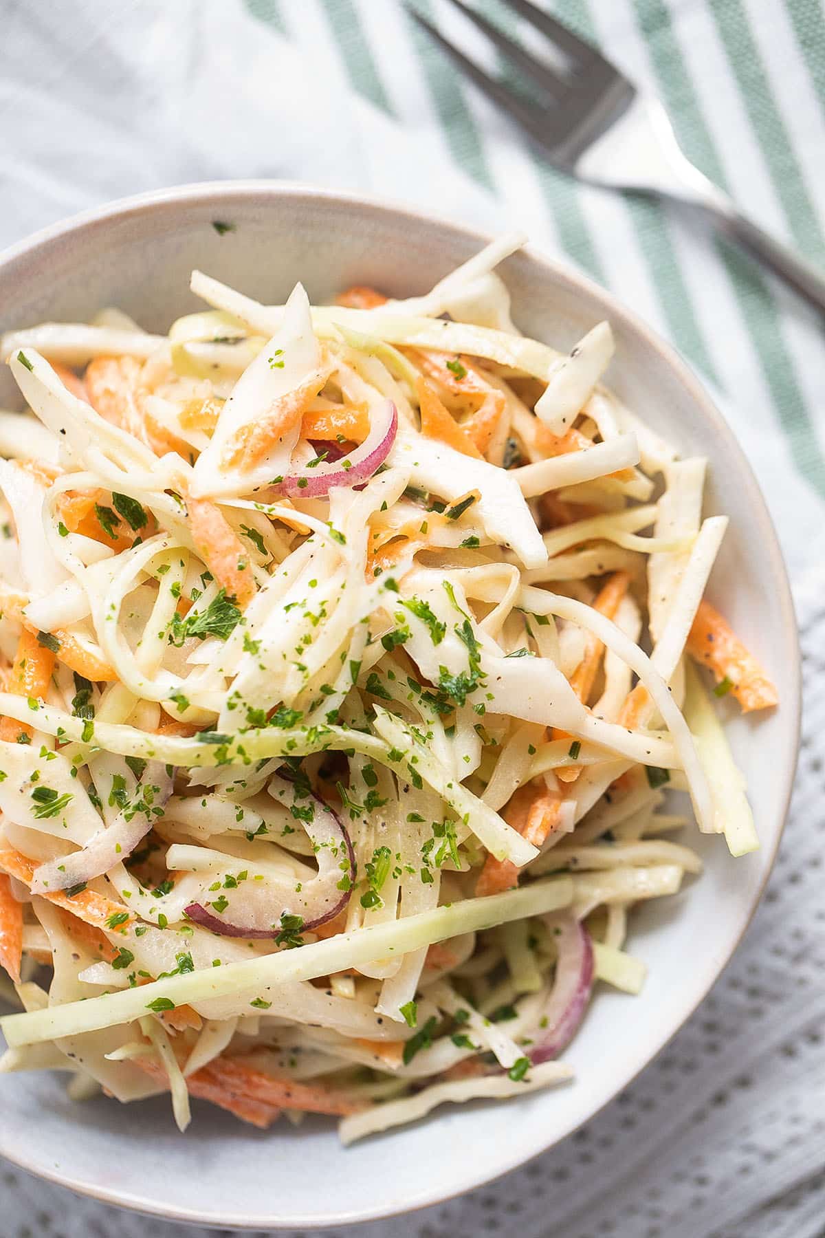 close up creamy coleslaw in a bowl.