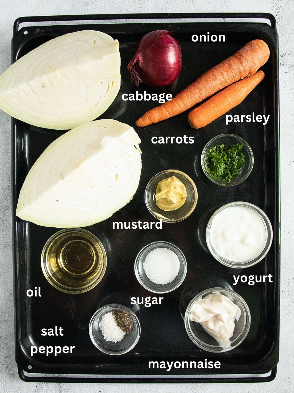 listed ingredients needed to make coleslaw with cabbage, carrots, and mayonnaise.