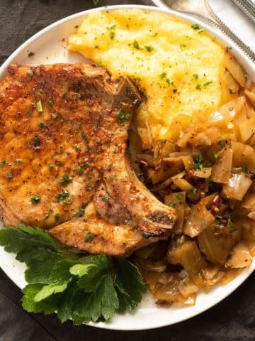 air fried pork chop served with polenta and cabbage.