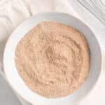 overhead view of a bowl with rib dry rub and a whisk.