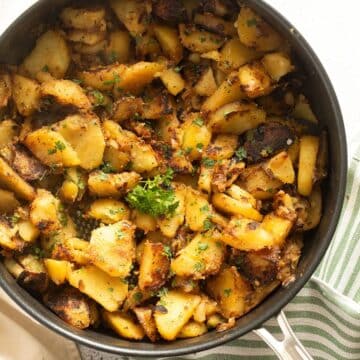 fried potatoes and onions in a skillet.