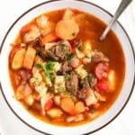 overhead view of a bowl of instant pot vegetable beef soup.