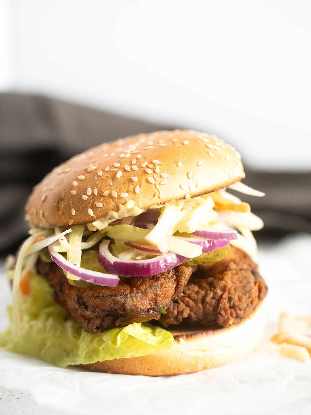 crispy chicken burger made with schnitzel and coleslaw.