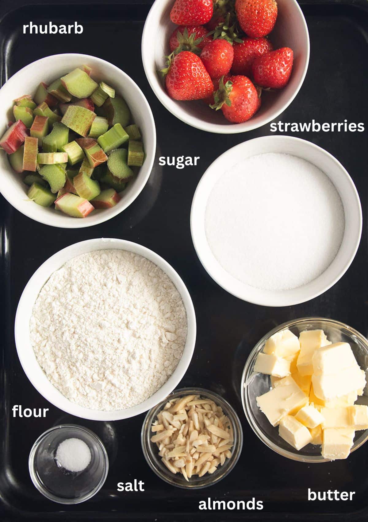 labeled ingredients for making a tart with strawberries and rhubarb.