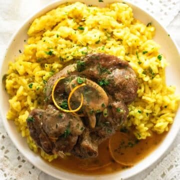 plate with veal shanks served on saffron risotto.