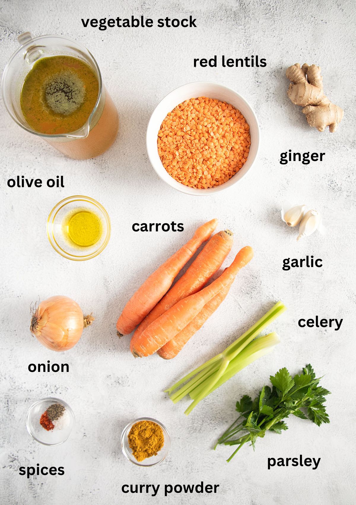 listed ingredients for making soup with carrots, lentils, ginger and curry powder.
