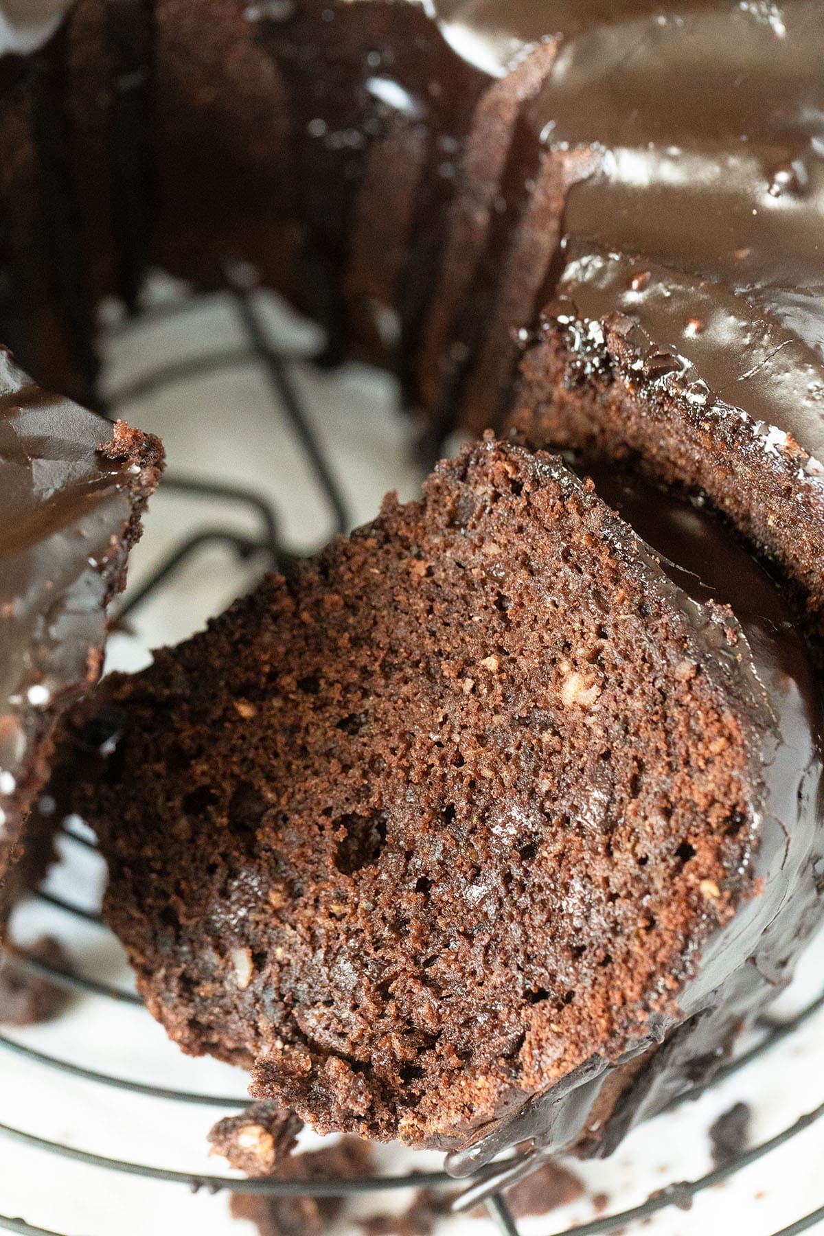close up of a moist slice of zucchini cake with chocolate.