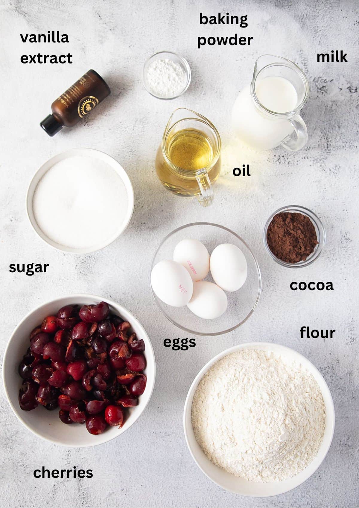 listed ingredients for making bundt cake with cherries, oil, eggs, flour, sugar and milk.