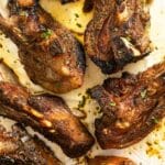 golden brown slow cooker lamb ribs close up.