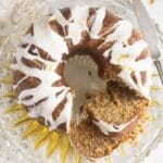 overhead image of sliced zucchini bundt cake with lemon glaze.
