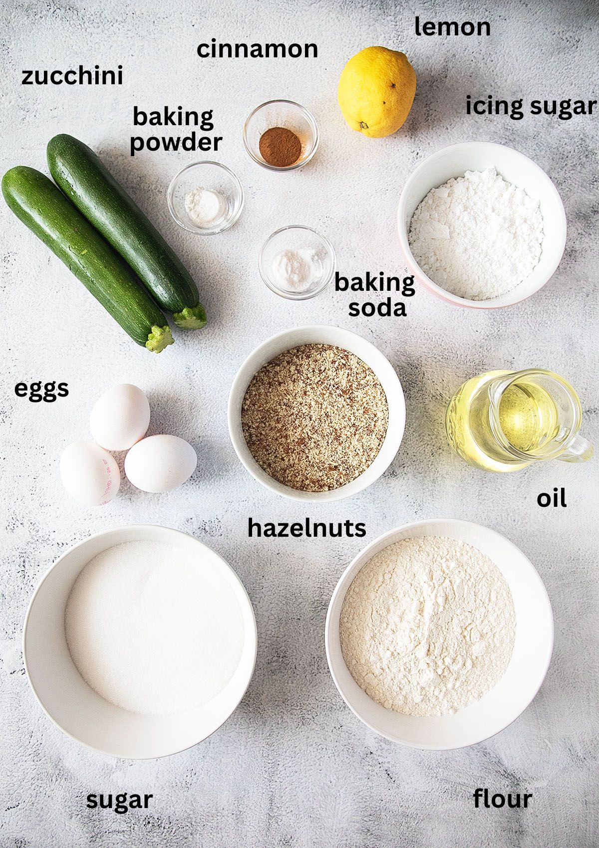 listed ingredients for making a bundt cake with zucchini and powdered sugar glaze.