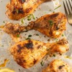 close up of a few instant pot chicken legs cooked from frozen and broiled in the oven.