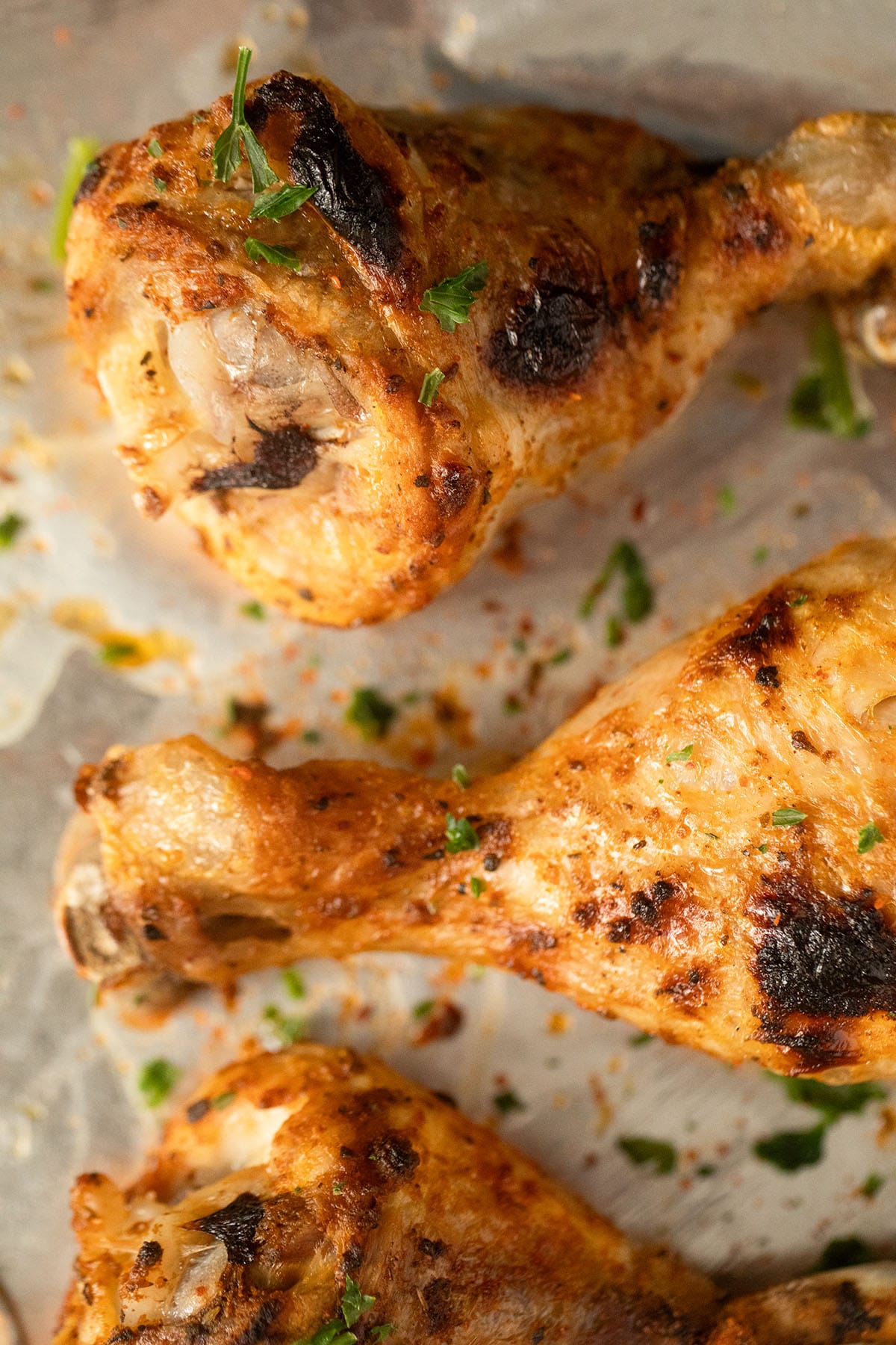 close up of golden and slightly charred instant pot chicken legs.