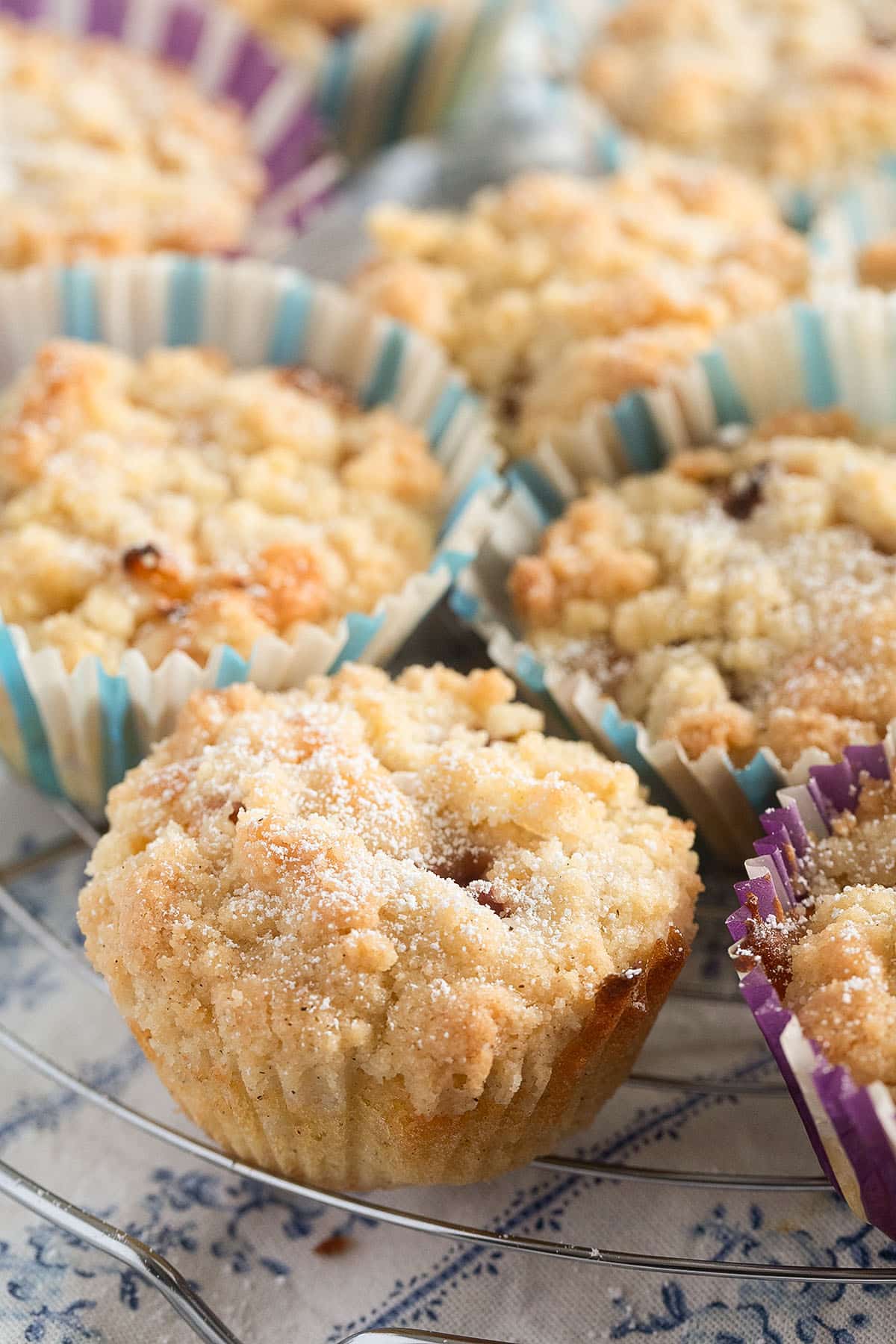 nectarine streusel muffins on a wire rack.