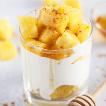 cottage cheese and pineapple layered in a serving glass.