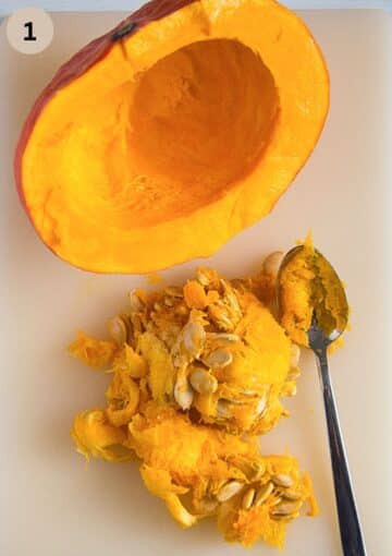 scooping the insides of a pumpkin with a spoon.