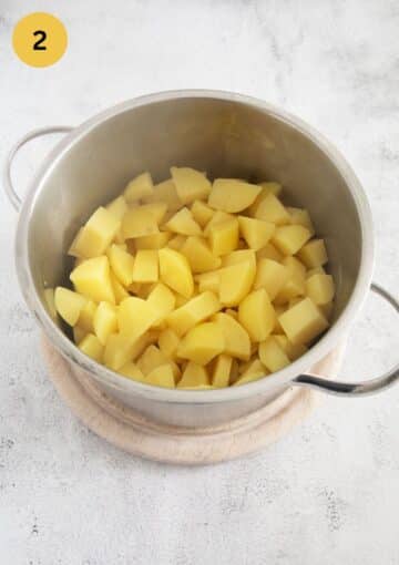boiled potato cubes in a pot.