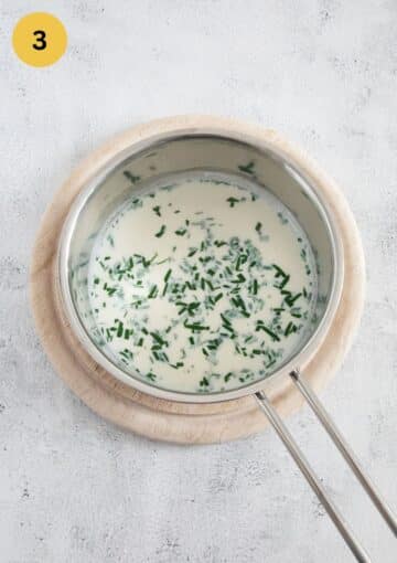 infusion of garlic and rosemary in milk in a small saucepan.