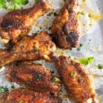 slow cooker turkey wings on foil sprinkled with parsley.