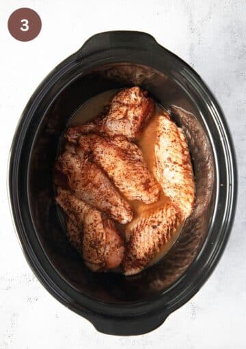turkey wings in a slow cooker before cooking.