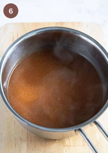 simmering gravy for turkey wings in a small saucepan.
