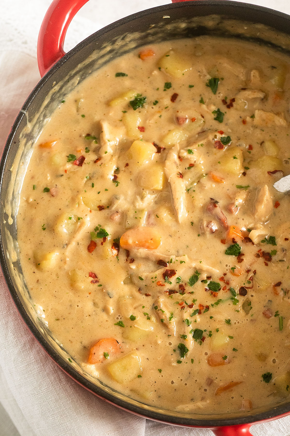 close up of super creamy soup with potatoes and turkey leftovers.