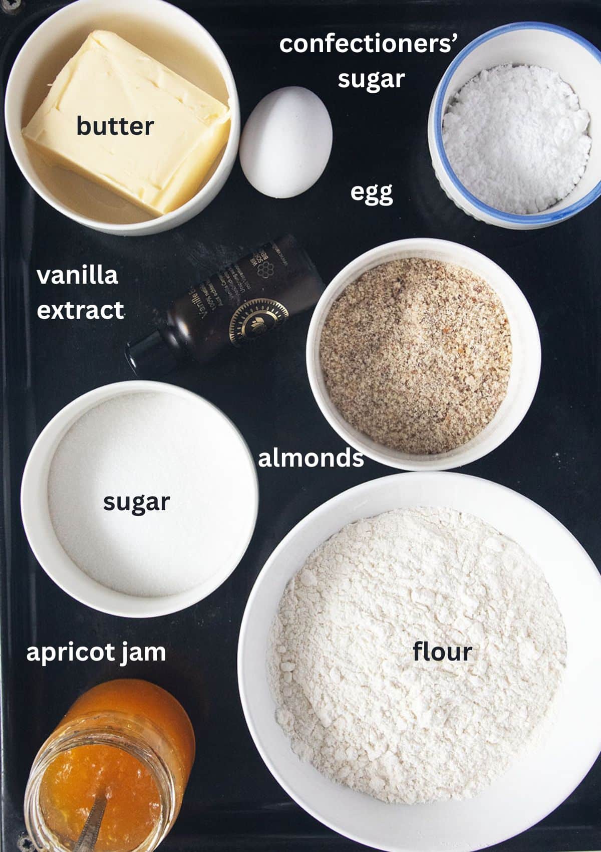 labeled ingredients for making linzer cookies with apricot jam.
