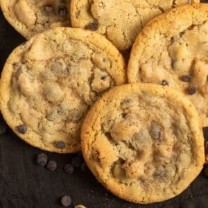 pecan chocolate chip cookies round and large, with a few chocolate chips around them.