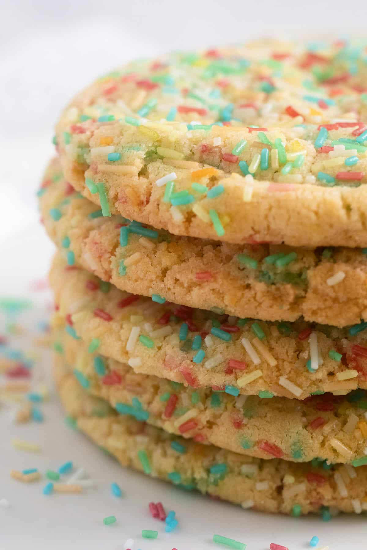 close up of a staple of cookies with sprinkles.