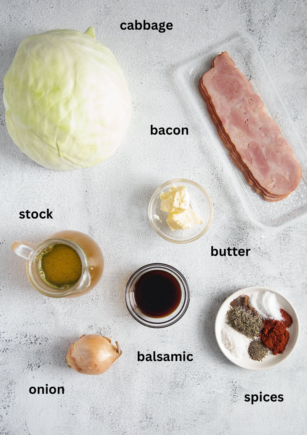 labeled ingredients for cooking white cabbage with bacon, onion, butter and spices.