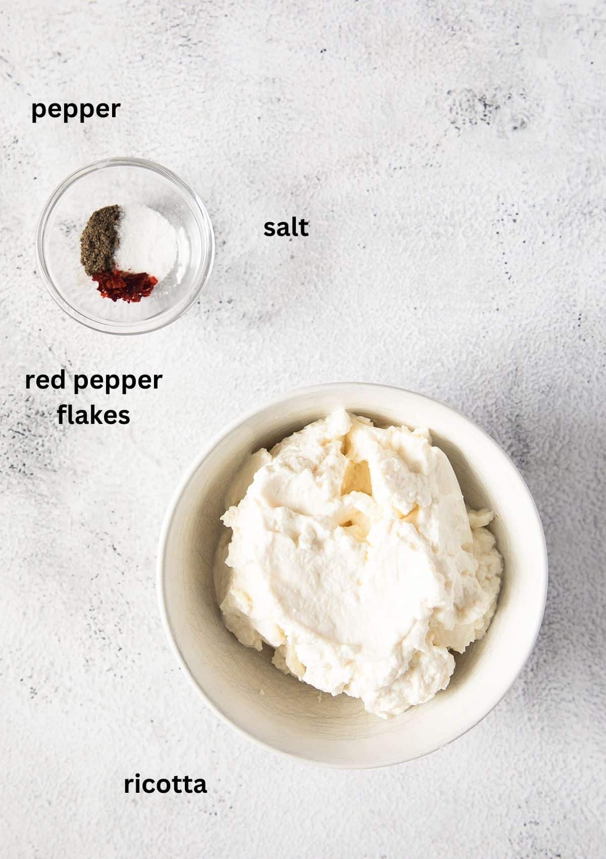 bowls with ricotta, salt, pepper, and red pepper flakes, all ingredients are labeled.