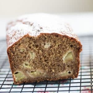 rhubarb and banana bread showing the rhubarb pieces inside the tender crumb.