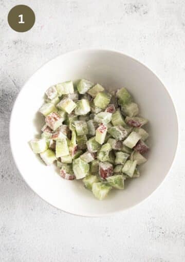 chopped rhubarb mixed with flour in a bowl.