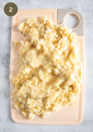 mashed bananas on a cutting board.