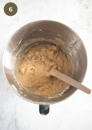 folding rhubarb pieces into cake batter using a spatula.