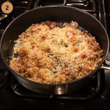 toasting risotto grain in the pan.