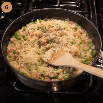 stirring butter and parmesan into risotto in a pan with a wooden spoon.