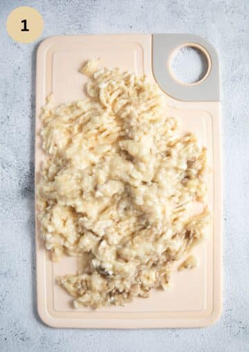 mashed bananas on a cutting board.