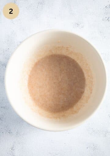 creamed coconut oil and sugar in a mixing bowl.