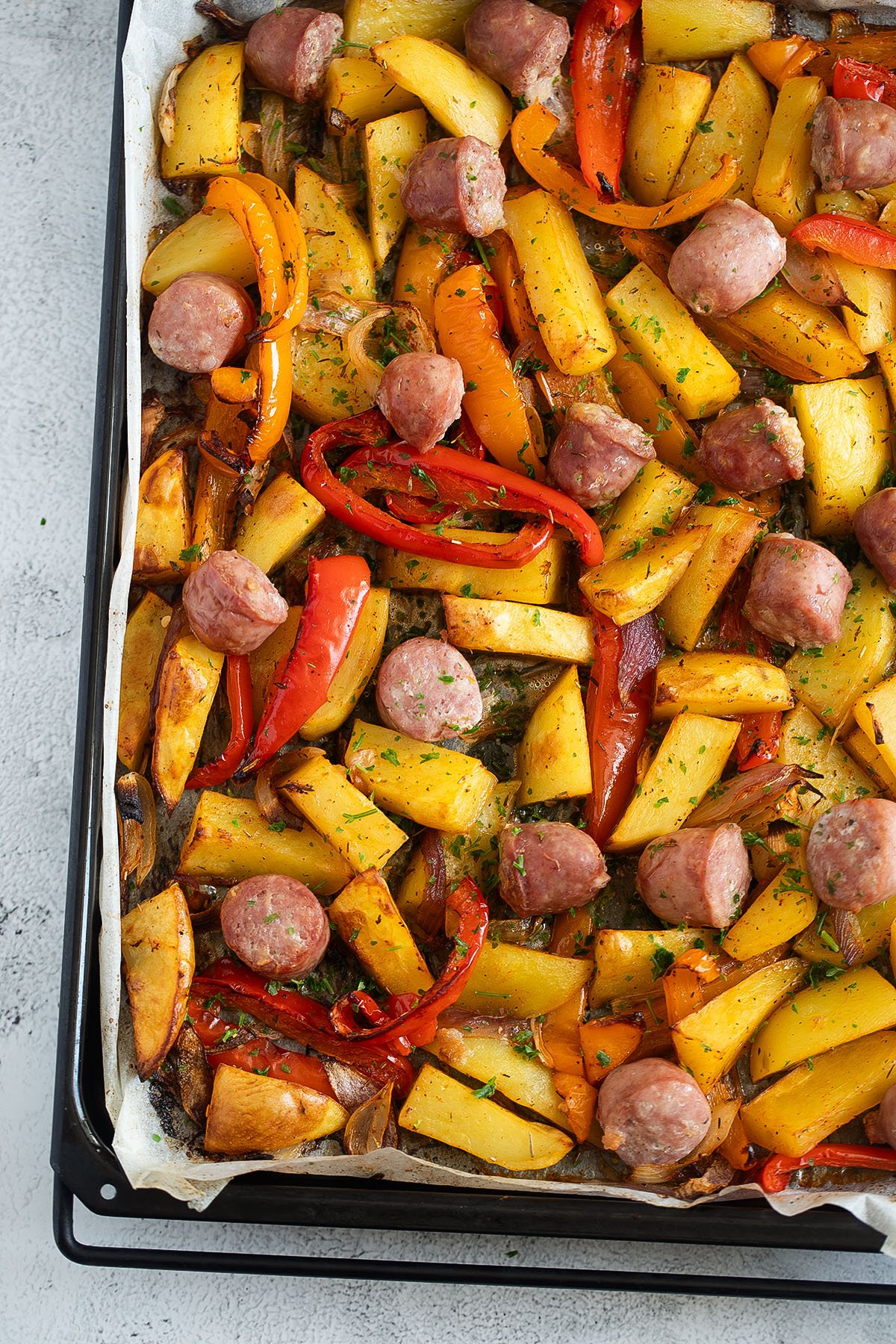 sheet pan sausages, peppers, onions and potatoes just out of the oven.