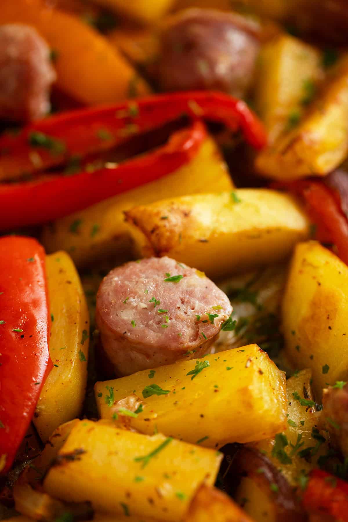 a few golden potato pieces, roasted peppers and sausage slices.