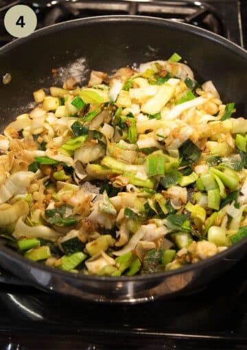 sauteing leeks in a large saucepan.