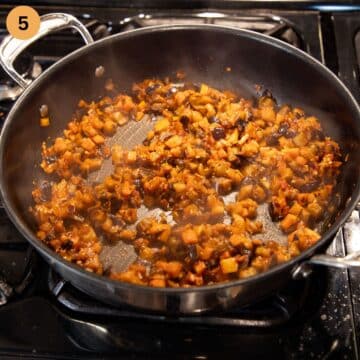 cooked eggplant pieces in a large pan.